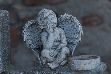 Angel watching over a tombstone