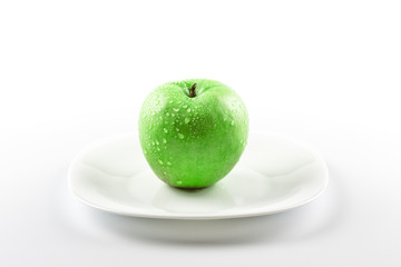 green apple on white dish