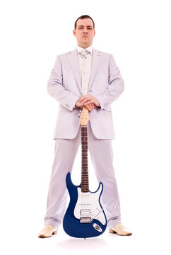 man standing with electro guitar