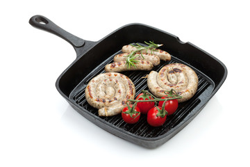 Grilled sausages on frying pan
