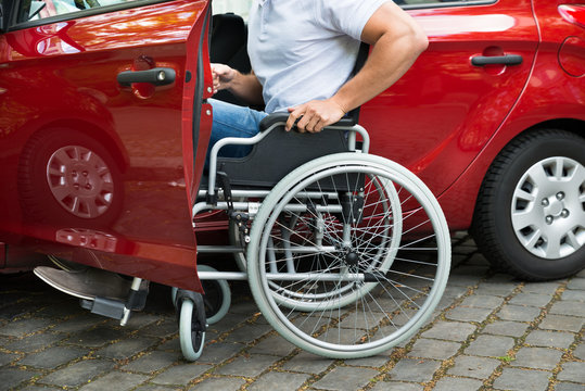 Disabled Man Boarding In His Car