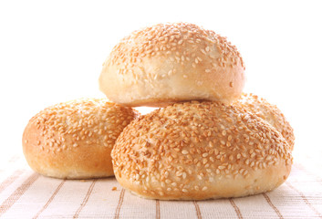 four buns with sesame seeds