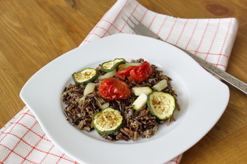 black canadian rice served with mushrooms, tomatoes, aubergine and zucchini