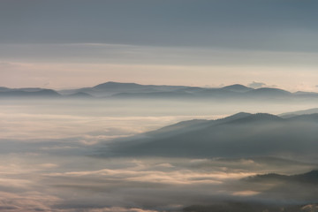 Landscape misty mountains in the morning sunlight.