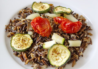 black rice with zucchini, tomatoes and paprika