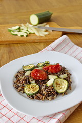 black rice with zucchini, tomatoes and paprika