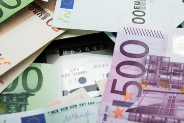 Euro Banknotes Over Electricity Meter