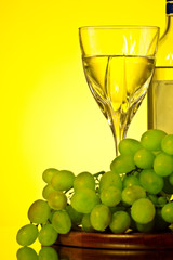 glass of white wine and grape