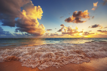 Sunrise on the beach of Caribbean sea © ValentinValkov