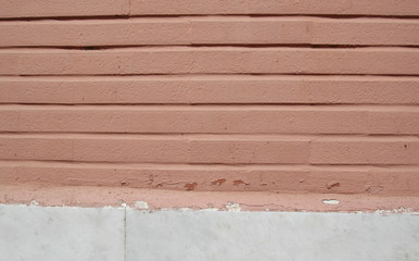 Old empty brick wall background, plaster falling off