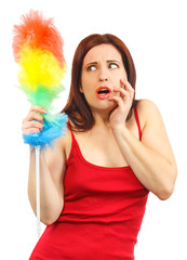 Frightened woman in red shirt with whisk for house dust