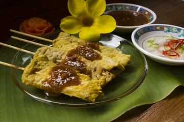 Pork satay with delicious peanut sauce, ketupat, onion and cucum
