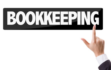 Businessman pressing button with the text: Bookkeeping