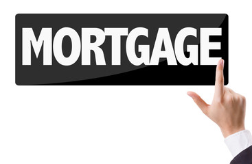 Businessman pressing button with the text: Mortgage