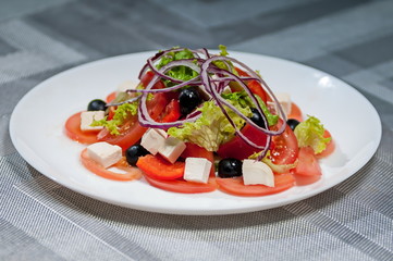 lettuce with tomatoes  cheese  bow and olives