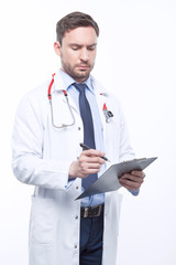 Thoughtful doctor holding papers 
