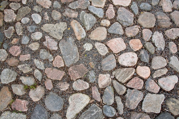Cobble stone road surface texture for background copy space.