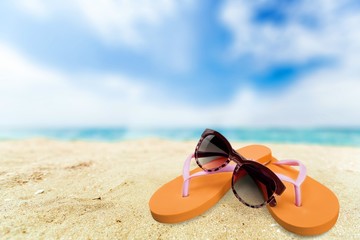 Fototapeta na wymiar Flip-flop, Beach, Sunglasses.