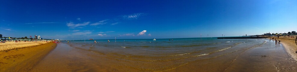 Fototapeta na wymiar Awesome sunny day at Lignano Sabbiadoro beach Italy