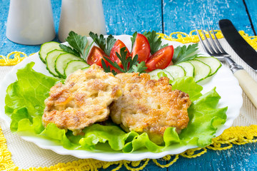 Homemade chopped cutlets with cucumbers and tomatoes