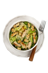 Caesar Salad with croutons on white background. Selective focus.