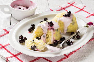 Freshly made pudding from cottage cheese with yoghurt sauce and