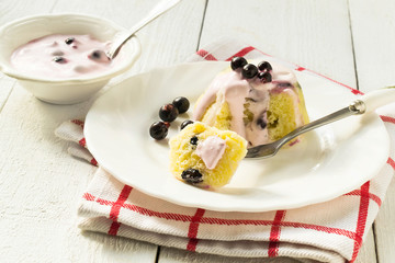 Fresh sweet pudding of cottage cheese with yogurt sauce and curr