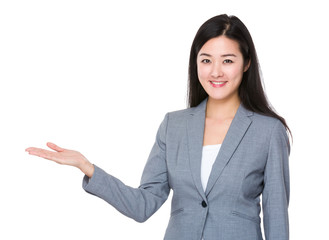 Businesswoman with hand showing something