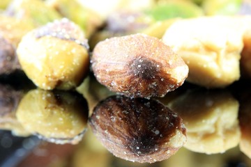 Mixed Salted Nuts Closeup - Health and Nutrition Concept 