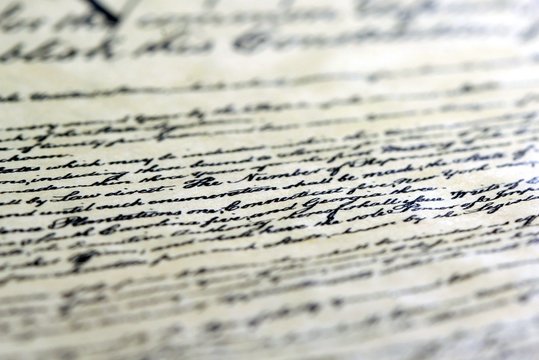Calligraphy handwriting on old vintage paper