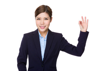 Businesswoman with ok sign gesture