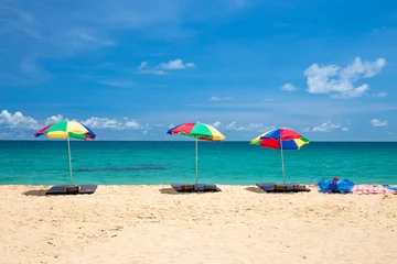 Foto auf Acrylglas beach umbrella and ring on beach with blue sky, phuket thailand © powerbeephoto