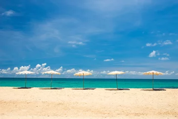 Foto op Plexiglas beach umbrella on beach with blue sky, phuket thailand © powerbeephoto
