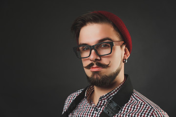 handsome guy with beard holding vintage camera 