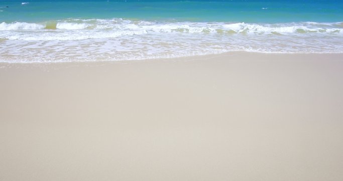 Tranquil scene of white sand beach on sea shore 