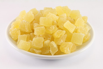 Dried pineapple on a white porcelain dish
