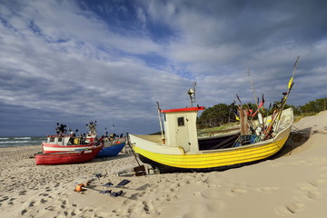 Small fishing boat, on the beach, of Baltic sea, Poland