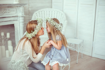 A happy mother and her daughter are going to kiss © Cliplab