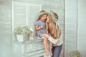 A girl and her mother are having fun together