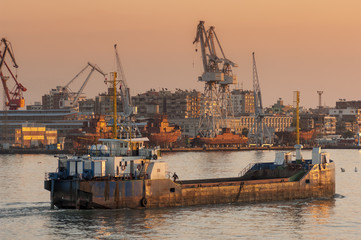 Naklejka premium Small freighter enters Suez Canal