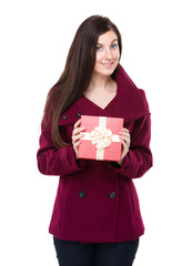 Fototapeta premium Brunette woman showing with present box