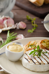 Grilled camembert with mini herbs baguettes