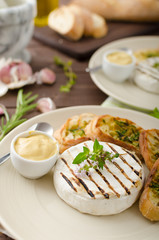 Grilled camembert with mini herbs baguettes