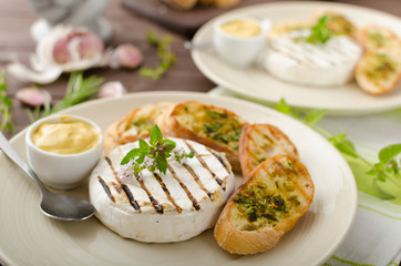 Grilled camembert with mini herbs baguettes