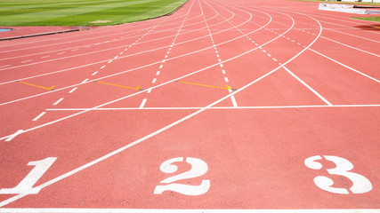 Red treadmill at the stadium with the numbering from one two three