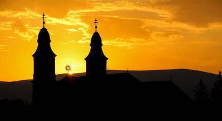 Silhouette of a catholic church in sunset