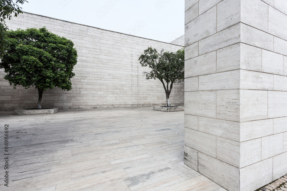 Wall mural white brick wall and empty sandstone road