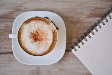cappuccino coffee with note book
