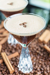 strong cold tonic cocktail with roasted coffee on a table in a