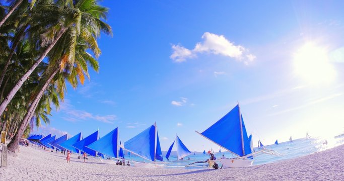 Many sail yacht boats on sea coast shore of Boracay tropical island resort
